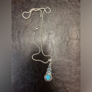 Silver and turquoise colored necklace